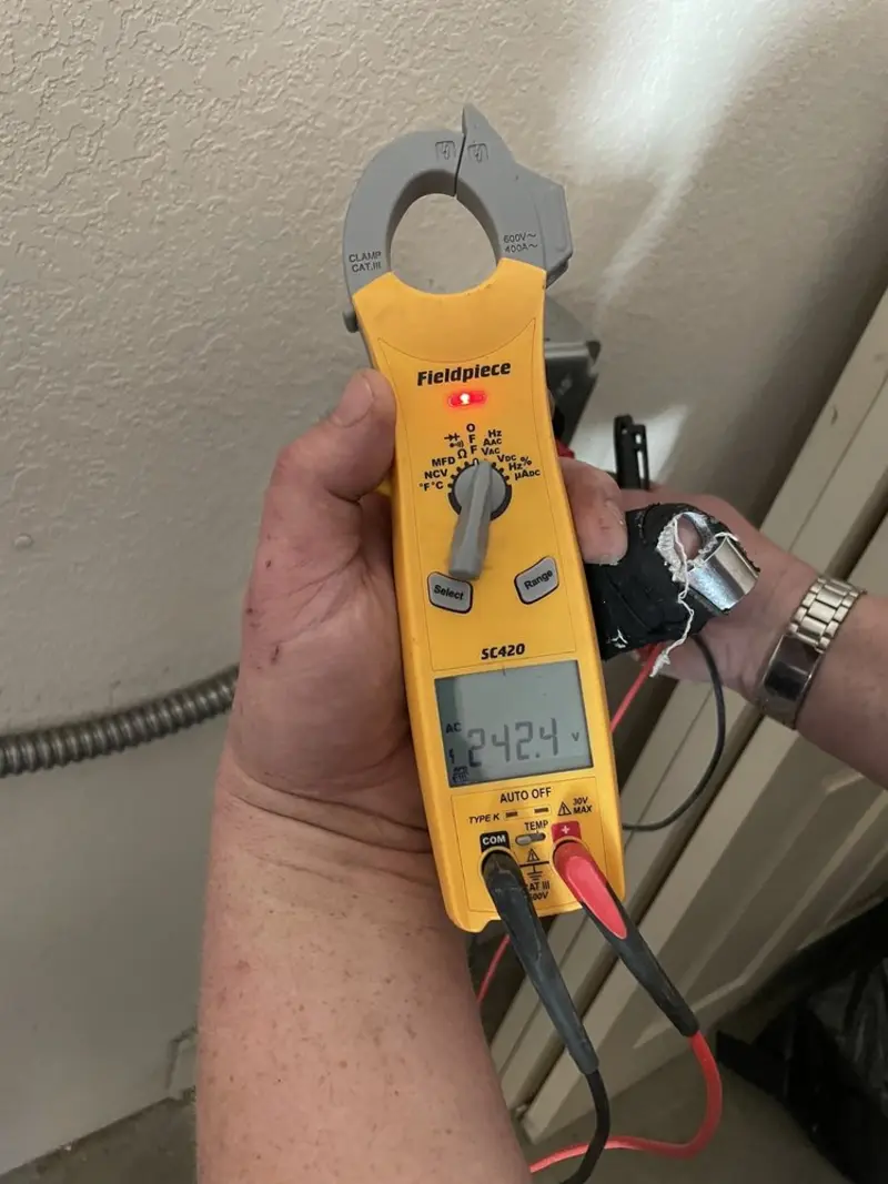 Voltage testing with clamp meter during Electrical Installation Services in Taylors